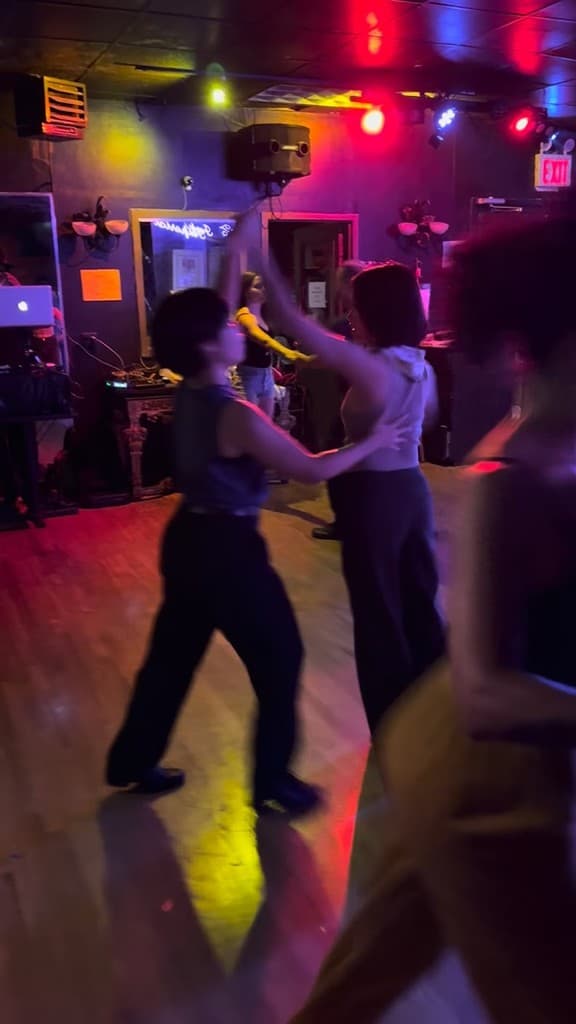 Dancing on a colorfully lit dance floor